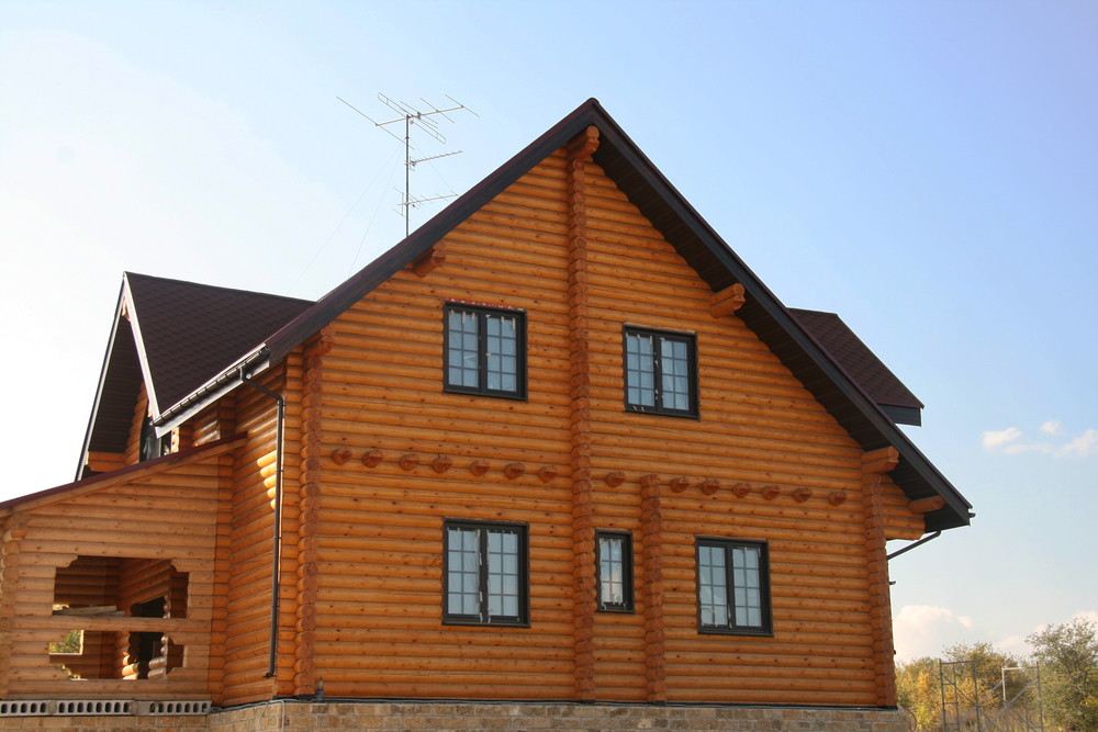 Custom Build Modern Green Log House.jpg